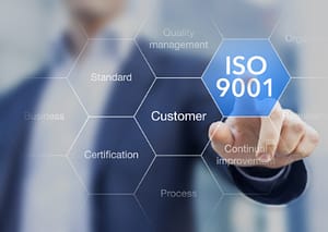 ISO 9001 standard for quality management of organizations with an auditor or manager in background.