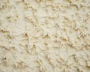 Textured exterior masonry coating magnolia