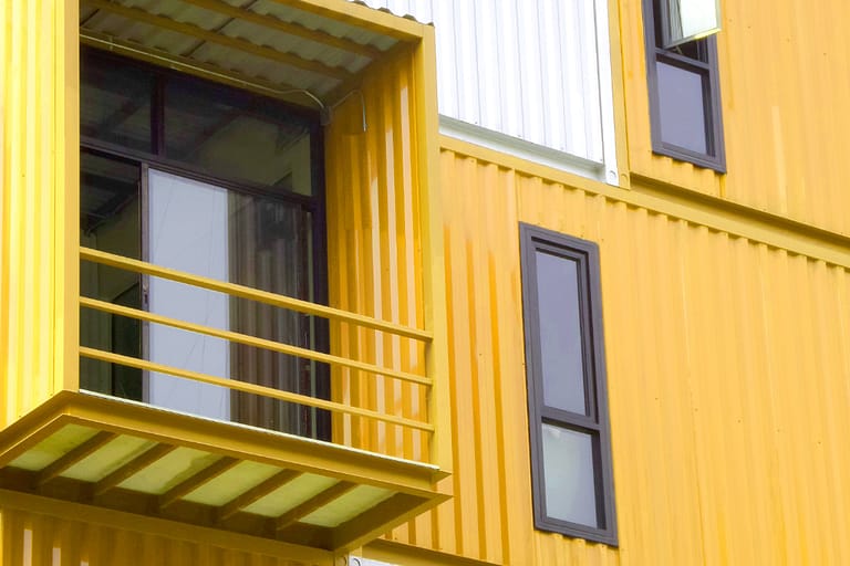 window of house made from container yellow and white